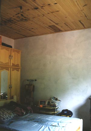 Photos above and below: Urandir Oliveira's body imprint on the blue and white cotton sheet,  pillow and wood ceiling. Photographs © 2003 by Linda Moulton Howe on February 9, 2003.