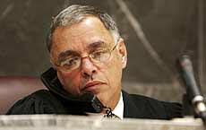 Broward Circuit Judge John Fusciante talks to Clonaid Vice President Thomas Kaenzig in Las Vegas by phone during January 22 hearing. Kaenzig was ordered to appear in court in person on January 29, 2003. Photograph by Susan Stocker, Pool Photo.