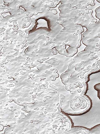 Mars Orbital Camera (MOC) view of the Martian south polar residual mesas  and pits in frozen carbon dioxide (MOC2-298), December 6, 2001. The portion  of the Martian south polar cap that persists through each southern hemisphere summer is known  as the residual cap. In summer, as carbon dioxide is subliming away, the scarps bounding the pits  and mesas darken with the red Martian soil, suggesting the layered ice and dust melt. Recent Mars Global Surveyor  MOC images acquired in 2001 indicate the scarps are retreating an average of 3 meters (3.3 yards) per Martian  year and might mean global warming. Photograph courtesy JPL and Malin Space Science Systems.