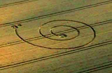 Spiral discovered in Stanton St. Bernard, Wiltshire, wheat near Celtic Knot on August 14, 1999, in same field as the earlier June 23 pictogram. Aerial Photograph © 1999 by Peter Sorensen. 