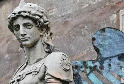 Archangel Michael depicted on the Ponte Sant'Angelo bridge in Rome, Italy, who is described in the Quran as “blowing on his trumpet, calling the angels when this Age is about to pass away.” See also: The Trumpet Is Blown Or Is It?