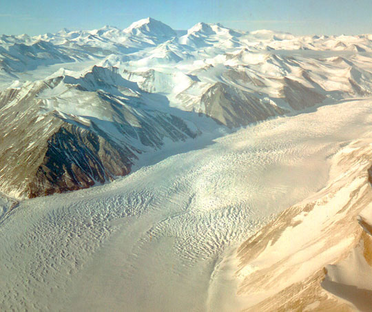 The Beardmore Glacier in Antarctica, one of the largest valley glaciers in the world at 125 miles long and 25 miles wide, was not far from where Brian and his Naval Flight crew repeatedly saw round, silver discs dart around in the Transantarctic Mountain peaks, but never over the Beardmore Glacier and not toward their C-130. Image by USGS.