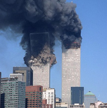 On September 11, 2001, at 8:45 AM EDT, hijacked American Airlines Flt 11 from Boston crashed into the north tower of the World Trade Center in NYC. At 9:03 AM EDT, a second hijacked airliner, United Airlines Flt 175 from Boston crashed into the south tower of the WTC. Both towers collapsed and killed nearly 3,000 people  and injured over 6,000 others. Video frame from CNN.