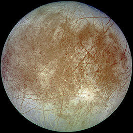 Jupiter's moon, Europa, (one of 49 known satellites) is 1,950 miles in diameter, almost as big as Earth's moon, and is the sixth-largest moon in our solar system. But its sister moon, Ganymede, is the biggest moon in the solar system at 3,280 miles in diameter (5,262 km). Cracked like an egg shell, Europa's icy crust covers a 62-mile-deep ocean of liquid water that has twice as much water as all of Earth's oceans combined. This false-color composite image combined violet, green and infrared images to enhance color differences in the predominantly water-ice crust of Europa. Dark brown areas represent rocky material derived from the interior, implanted by impact, or from a combination of interior and exterior sources. Bright plains in the polar areas (top and bottom) are shown in tones of blue to distinguish possibly coarse-grained ice (dark blue) from fine-grained ice (light blue). Long, dark lines are fractures in the crust, some of which are more than 3,000 kilometers (1,850 miles) long. The bright feature containing a central dark spot in the lower third of the image is a young impact crater some 50 kilometers (31 miles) in diameter. This crater has been provisionally named “Pwyll” for the Celtic god of the underworld. This image was taken on September 7, 1996, at a range of 677,000 kilometers (417,900 miles) by the solid state imaging television camera onboard the Galileo spacecraft during its second orbit around Jupiter. The image was processed by Deutsche Forschungsanstalt fuer Luftund Raumfahrt e.V., Berlin, Germany. Image source: http://photojournal.jpl.nasa.gov/catalog/PIA00502.
