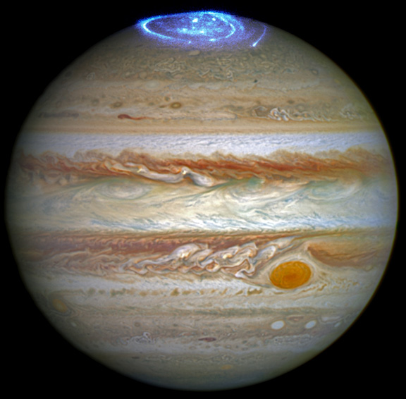 NASA Hubble Space Telescope image of Jupiter and blue aurora at the massive gas planet's poles. Credit: 2016 NASA, ESA, J. Nichols, Univ. of Leicester.