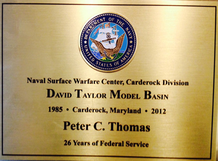 Peter Capwell Thomas's retirement plaque of U. S. Navy service from February 1985 to October 2012, with the Naval Surface Warfare Center in Carderock, Maryland. Image from Peter Thomas.