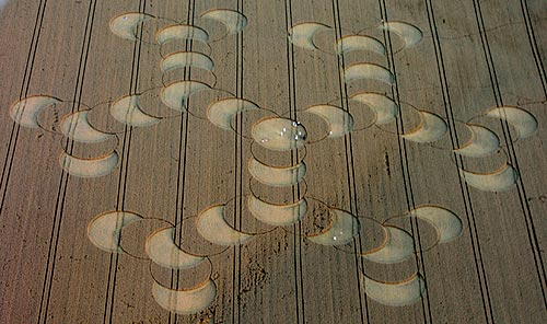 Large “molecule” formation reported August 10, 2003, spanning approximately 750 feet in a wheat field directly east of the July 6, 2003, 11-concentric-ring formation. Aerial photograph © 2003 by Mark Fussell, cropcircleconnector.