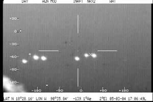 At 5:07:05 p.m. local time on March 5, 2004, at least eleven objects, small and large, show up on "white hot" polarity of FLIR camera.