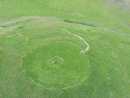 Seven foot square shaft that unexpectedly opened up in top of 6,000 year old Neolithic Silbury Hill and reported to local Avebury, Wiltshire police on May 29, 2000. Britain's private conservation charity, the National Trust, sealed off the hill for public safety and repairs. Photograph © 2000 Wiltshire Gazettte and Herald.