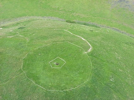 Seven foot square shaft that unexpectedly opened up in top of 6,000 year old Neolithic Silbury Hill and reported to local Avebury, Wiltshire police on May 29, 2000. Britain's private conservation charity, the National Trust, sealed off the hill for public safety and repairs. Photograph © 2000 Wiltshire Gazettte and Herald. 