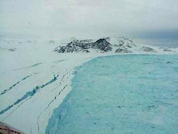 This Antarctic 1,255-square-mile-long ice shelf of 720 billion tons of ice collapsed into the Weddell Sea over thirty-five days in early 2002. Scientists believe the 220-meter- thick shelf had been in place for 5,000 to 12,000 years. Its disintegration was the third, sudden collapse of an Antarctic ice shelf, following the collapses of the 425-square-mile Wilkins Ice Shelf in 1998 and the 618-square-mile Larsen A Ice Shelf in 1995.  Photo courtesy NASA.