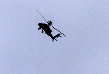 Solid black Apache helicopter that turned low over me at the Woodborough church around 10 a.m. on Tuesday, August 29, 2003. Photographs © 2003 by Linda Moulton Howe.