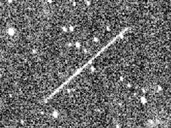 Top: The 1994 XM asteroid appeared as a trail in images taken on December 9, 1994. Bottom: Compare to image on right which shows the asteroid some 4.5 hours later. The asteroid was about 550,000 kilometers away from Earth at the time, on its way to a record close approach of some 105,000 kilometers (65,258 miles) only 12 hours later.