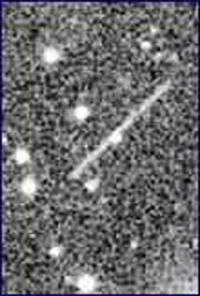 Hundreds of near-earth asteroids such as this one orbit around the sun. Some are bigger than a mile across and a collision with earth would cause global destruction. Others are much smaller such as Near-Earth Object 2000 SG344 discovered September 29, 2000. Its size is estimated at only 150 feet. But what is it? Why is it pacing with our planet in the earth's plane? And could it hit the earth in 2071? Photograph courtesy NASA 2000.