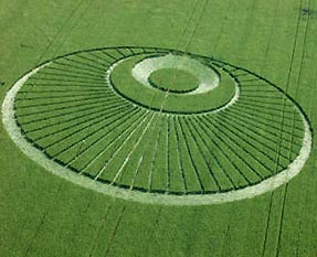 Above, crop formation reported June 24, 2003, in Mielen-Boven-Aalst (Gingelom), Belgium. Very similar to the Gog Magog Hills "angel" formation below discovered July 25, 2001, southeast of Cambridge, Cambridgeshire, England. "Disturbing humming sound" was reported by people living near the field in Belgium.