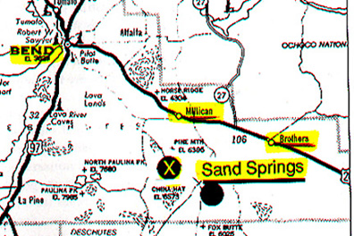 Oregon map with Sand Springs highlighted southeast of Bend near Brothers and Millican. The Millican Valley between Millican and Brothers is where the dozen dead calves were found March 18 and 19, 2000. It's also where fourteen dead calves and a pig with its legs cut off were found in March 1999. The circled X marks the area where eyewitness Dwain Wright saw mutilated bull and where a cowboy described having seen glowing discs that lifted cattle up in glowing beams and dropped them back down through the trees in late 1970s to early 1980s.