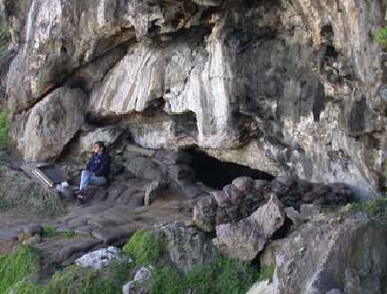 Blombos Cave entrance. Photographs in color and black and white below © 2001 by Christopher Henshilwood, Ph.D. 