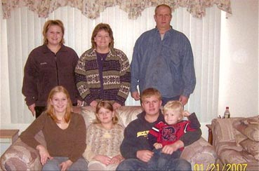 Myra and Torrey Briese family, photographed January 21, 20007. Sitting L-R: Trista, Tia, Evan, and Marshel. Standing L-R: Tessa, Myra and Torrey. Image © 2007 by Laurie Jablonski.