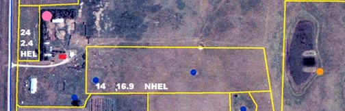  In this Kidder County Soil Conservation District satellite image of the Torrey and Myra Briese farm in Tappen, North Dakota [top is north], the pink circle in upper left is the location of the pig corral. Red rectangle is farm house. One-half mile east, the dark rectangle between two tan-colored embankments is a dug out water hole on the neighbor's property. The orange circle marks location of October 2005 dead cow at eastern edge of southern embankment. Blue dots are Soil Conservation District's code for wetlands.