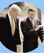 White House Chief of Staff, John Podesta, (on right) briefs President Bill Clinton as they walk to the Oval Office in 1999, Washington, D. C. Photograph courtesy White House files.