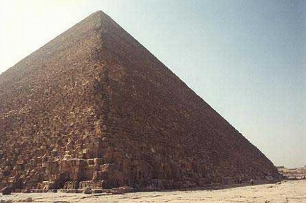 Great Pyramid of Khufu or Cheops located across the Nile River about six miles west of Cairo, Egypt in an area called the Giza Plateau. The pyramid is 481.4 feet high, contains an estimated 2,300,000 carved stones, each estimated to weigh an average 2.5 tons. Photograph © by Steve Beikirch.