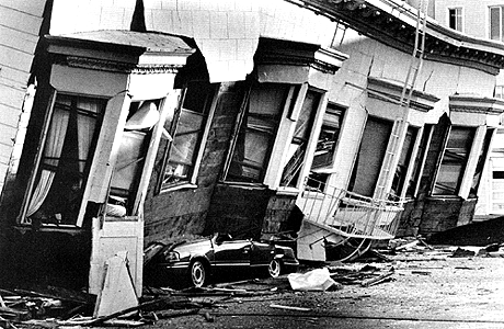 An apartment building in San Francisco's Marina District was thrown from its foundation and crushed a car in the 1989 magnitude 7.1 earthquake. The Marina District was the scene of voracious fires caused by broken gas lines. Photo by Vince Maggiora.