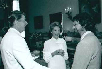President Ronald Reagan on left, wife Nancy, and on right, E.T. film director, Steven Spielberg, at White House screening in 1982. Photograph from Ronald Reagan Presidential Library, Simi Valley, California.