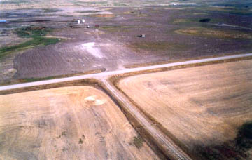 Second simple wheat circle reported on August 25, 2003, near Steelman, Saskatchewan, Canada, was one of two in same area that year. Now on August 27, 2005, another simple circle was reported in Steelman. Aerial photograph © 2003 by Paul Anderson.