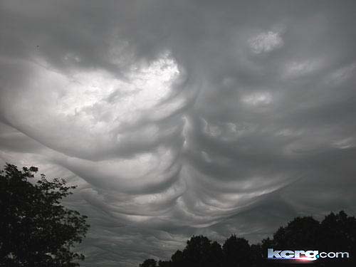 Very low, double row of ominous-looking clouds in the morning of June 20, 2006, over Cedar Rapids, Iowa. Image © 2006 by Melikssa L. Looney, outside Sacred Heart Convent.