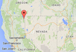 Cedarville (red pointer), population 514, is in Surprise Valley of Modoc County, California. The green valley has hot springs and artesian wells. Lassen Volcanic National Park is 143 miles southwest and Vya, Nevada, is 22 miles straight east. All three areas have felt the swarm of earthquakes numbering in the thousands. Some Surprise Valley residents have felt the 112 magnitude-3 and twelve magnitude-4 quakes since they started in July 2014. In addition to increasing quakes, Surprise Valley has also had repeating loud rumbling sounds associated with many appearances of unidentified aerial lights. USGS, Stanford University and other university seismologists are now studying unusual and sudden hot springs temperature changes in November 2014.