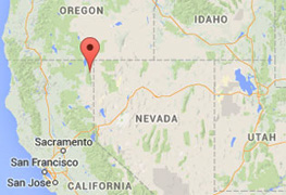 Cedarville (red pointer), population 514, is in Surprise Valley of Modoc County, California. The green valley has hot springs and artesian wells. Lassen Volcanic National Park is 143 miles southwest and Vya, Nevada, is 22 miles straight east. All three areas have felt the swarm of earthquakes numbering in the thousands. Some Surprise Valley residents have felt the 112 magnitude-3 and twelve magnitude-4 quakes since they started in July 2014. In addition to increasing quakes, Surprise Valley has also had repeating loud rumbling sounds associated with many appearances of unidentified aerial lights. USGS, Stanford University and other university seismologists are now studying unusual and sudden hot springs temperature changes in November 2014. 