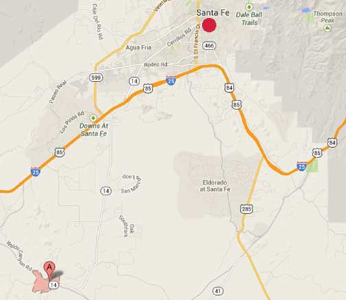 Los Cerrillos, New Mexico (Google marker) is 25 miles southwest of Santa Fe.