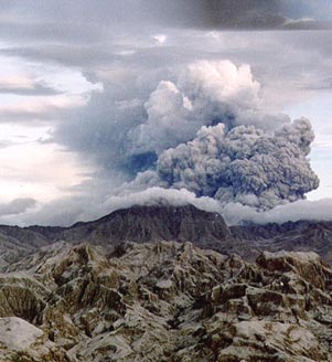  Mount Pinatubo had been dormant for 500 years. Then on July 16, 1990, a magnitude 7.8 earthquake struck about 60 miles (100 kms.) northeast of Mount Pinatubo on the island of Luzon in the Philippines. A year later on June 15, 1991, the volcano exploded in a massive eruption that ejected more than 5 cubic kilometers of volcanic material. The ash cloud rose 22 miles (35 kilometers) into the air.