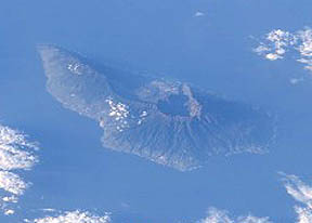 Satellite photo of 4-mile-high Cumbre Vieja, La Palma, Canary Islands, (Spain) volcano, west of La' Youn, Morocco, Africa. Three miles of the volcano are below the surface of the Atlantic Ocean; just over one mile is above the surface. Image courtesy of the Image Analysis Laboratory, NASA Johnson Space Center. 