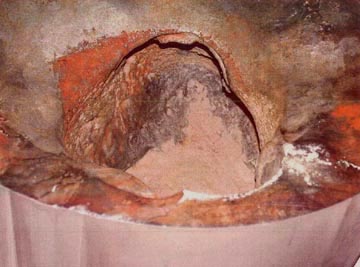 Large hole eaten away by leaking boric acid from a cracked reactor drive nozzle at the Davis Besse nuclear power plant in Toledo, Ohio. Discovered in 6-inch steel casing and photographed in spring 2002. Plant shut down to avoid potential core melt down. Photograph from Nuclear Regulatory Commission.