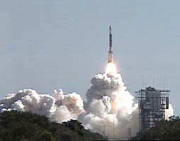 Top: Deep Impact lifted off January 12, 2005, at 1:47:08.574 PM ET from pad 17-B at Cape Canaveral Air Force Station, Florida, bound for Comet Tempel 1. Image courtesy NASA. Bottom: Arrow points to Comet Tempel 1 photographed on December 11, 2004, by Observatoriode Begues, Spain. The plan is to create a crater by impacting the icy snowball on July 3-4, 2005, to see what it's made of. Image from Observatorio de Begues.