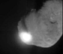 Moment of impact on potato-shaped Comet Tempel I at 10:52 p.m. PDT, July 3, 2005 / 1:52 a.m. EDT, July 4, 2005. Image by NASA, ESA, Johns Hopkins University Applied Physics Lab.