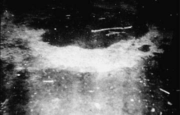Photograph taken on November 2, 1971, immediately after eyewitness Ron Johnson's encounter with an unidentified aerial craft that emitted a liquid-looking substance onto the ground in Delphos, Kansas. Whatever the substance was, it caused a glowing ring. Photograph © 1971 by Ron Johnson, provided with permission by Ted Phillips, Former Investigator, Center for UFO Studies (CUFOS).