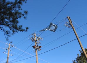 Odd, aerial object above power poles near construction site in May 2006, in Birmingham, Alabama. Photo by Mr. Smith.