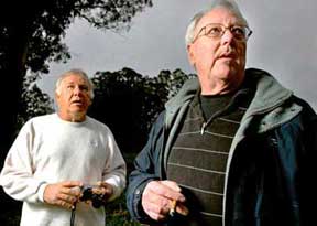 Los Angeles Times photo caption: “Private eyes Frankie Dixon, left, and T.K. Davis at a park in Capitola, Calif., where they’re investigating reports that a UFO was photographed by a man with the Internet name of Raji, who later vanished into cyberspace.” Image © 2008 by Los Angeles Times.