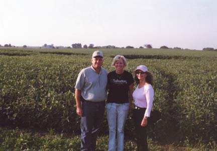 Jim and Chris Stahl with Linda Moulton Howe at the Geneseo soybean formation on Thursday, July 24, 2006. Photograph by Ted Robertson for © 2006 Earthfiles.