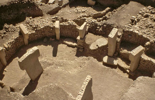 12,000-year-old circles of limestone pillars each weighing from 10 to 20 metric tons or more have been excavated in Gobekli Tepe, Turkey, about 9 miles (15 km) northeast of Sanliurfa, formerly known as Urfa or Edessa. More than twice the age of Mesopotamia,  40 standing T-shaped columns have so far been revealed in four circles between 30 feet  and 98 feet (10 to 30 meters) in diameter. Ground-penetrating radar indicates there  are still 250 more pillars buried in 16 circles extending over another 22 acres of the 30-acre Neolithic site. Image © 2008 by Haldun Aydingun.