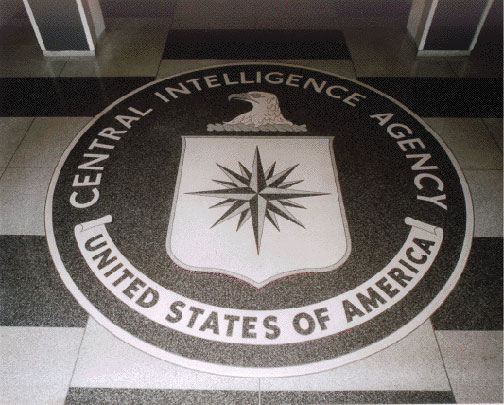 The 16-foot-diameter granite CIA seal in the lobby of the original headquarters building. The official seal of the Central Intelligence Agency approved on February 17, 1950, in President Harry Truman's Executive Order 10111. The CIA came into being on September 18, 1947, when Truman signed the National Security Act two and a half months after the recovery of at least three wedge-shaped craft and non-human bodies from three different sites in the region of Roswell, New Mexico. The majority of the provisions of the Act took effect on September 18, 1947, the day after the Senate confirmed James Forrestal as the first  Secretary of Defense. A year and a half later on May 22, 1949, Forrestal was found dead at Bethesda Naval Medical Center where he had been treated for severe mental depression. Were the stresses of trying to cope with an extraterrestrial presence while carrying out strict policies of denial about the ETs the true cause of Forrestal's mental deterioration and suicide or murder?