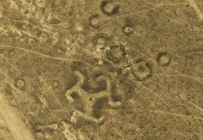 Turgay Swastika next to circles or rings first discovered in February 2007 by Kazakh archaeologist Dimitriy Dei. The 3-armed pattern is unusual, measures 90 meters in diameter, or 295 feet, and is estimated to be 7,000 to 8,000 years old. Google Earth image.