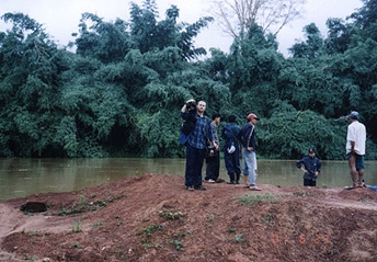 Videographer Brad Dillon, Soukhasavanh Sanaphay and Phoudoi Travel representatives assessing river height. Could we cross? Photograph by Linda Moulton Howe.