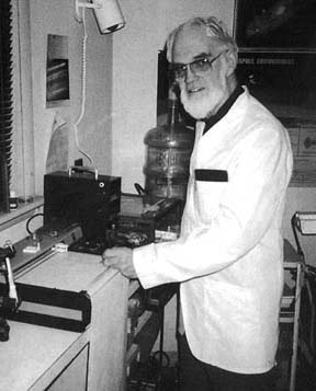W. C. Levengood taking respiration measurements of Charge Density Plasmas from crop formation plants in his Pinelandia Biophysical Laboratory in Grass Lake, Michigan. Photo by Linda Moulton Howe.