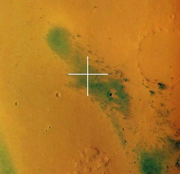 The center of the Gusev crater with the landing site of the NASA Spirit rover marked with a cross. The image was taken by the HRSC instrument in color and 3-Dimension on January 16, 2004, from a height of 320 kilometers (199 miles). Gusev is a large crater about 160 kilometers in diameter. Scientists believe that the crater was covered by standing water, maybe in the form of a lake, early in the history of Mars. Image by European Space Agency's Mars Express: ESA/DLR/FU Berlin (G. Neukum).