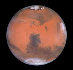  North and south poles of Mars are icy. Photo courtesy Hubble Space Telescope.