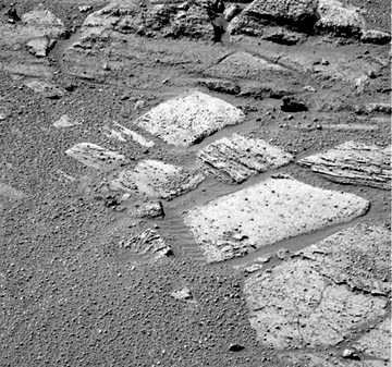 Above: Opportunity Rover is now moving along bedrock after discovering a large percentage of sulfur in the rocks. Image courtesy: NASA/JPL/Cornell. Below: Could the Martian Meridiani Planum have once looked liked the boiling hot volcanic spring below? 