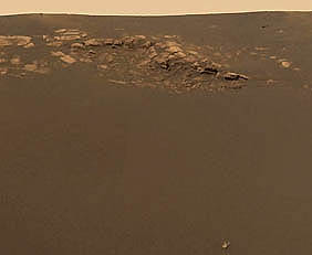 Actual length of the entire bedrock outcrop is only 50 feet long and the distance from the outcrop to the small, white, unidentified object at the bottom of the frame is no more than about 14 feet. The small "horned" object, according to Prof. James Rice, is about "the size of a man's fist." Original Opportunity panoramic image credit: NASA/JPL/Cornell.